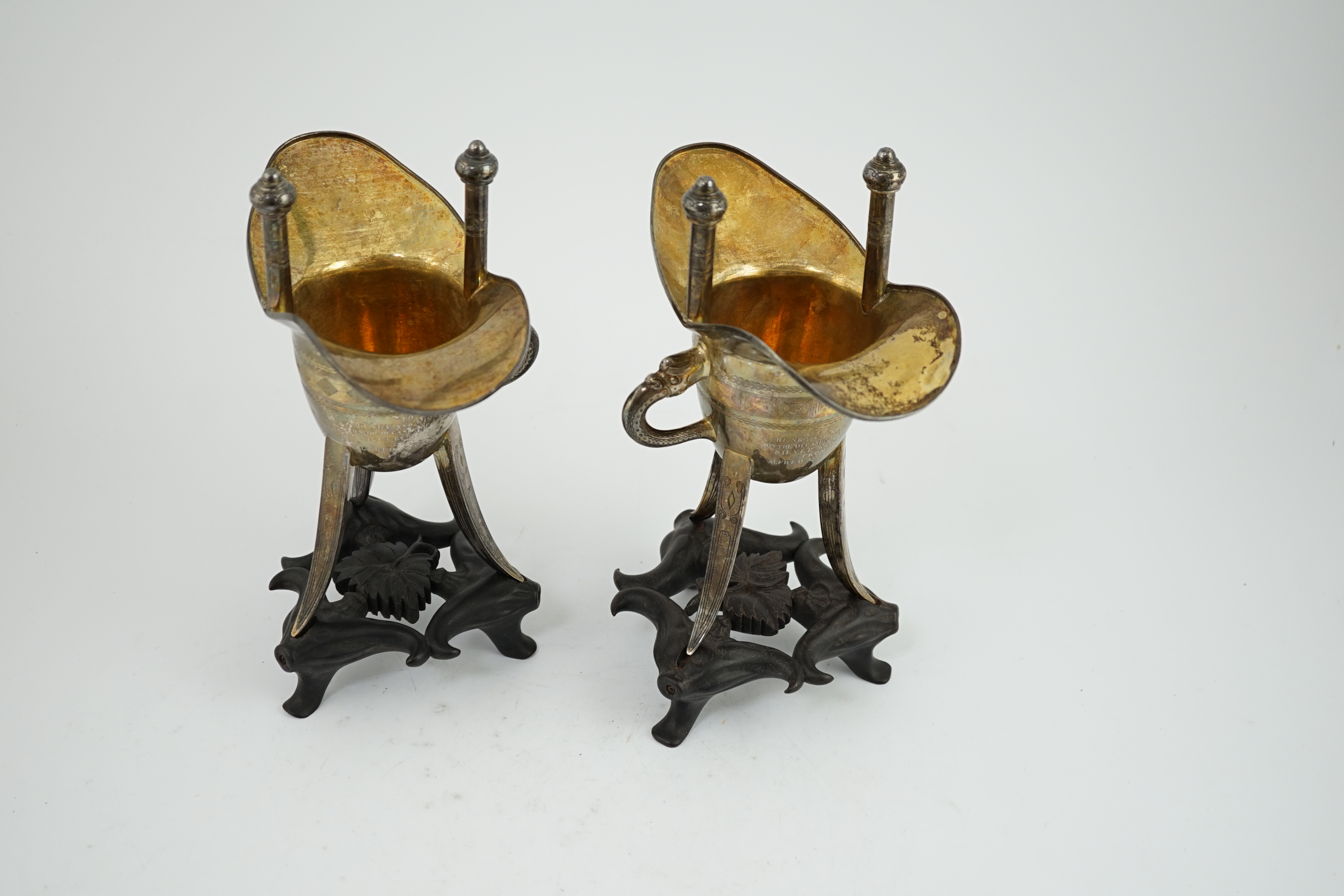 A pair of early 20th century Chinese archaistic silver 'Jue' wine cups, by Wang Hing, Hong Kong